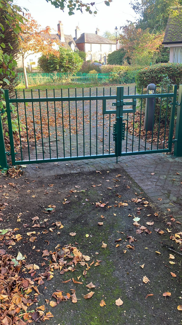 Green Vertical Bar Gates Installation in Essex by Almec Fencing 